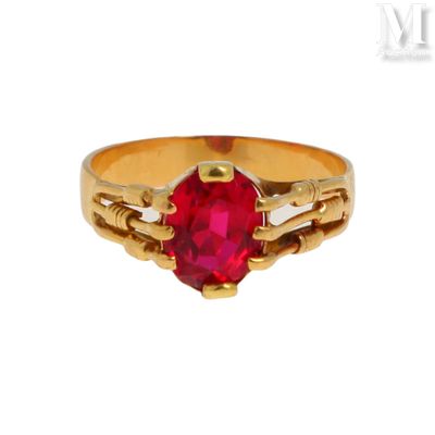 une image représentant une bague en or sertie d'un rubis