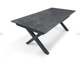 a black table with a cross legs on a white background