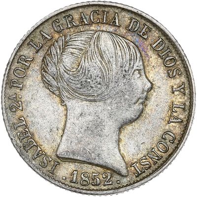gros plan d'une pièce de monnaie sur laquelle figure un visage de femme