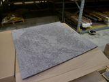 a pile of cardboard sitting on top of a pallet in a warehouse
