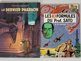 deux livres posés sur une table blanche, avec une image représentant un homme et un dragon