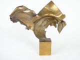 bronze sculpture of a bird on a wooden base on a white surface