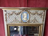 a mirror that has a picture of a man in a hat on it