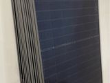 a close up of a stack of solar panels in a room