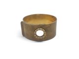a close up of a brass ring with a hole in the middle