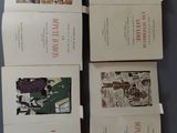 four books with pictures of people on them sitting on a table