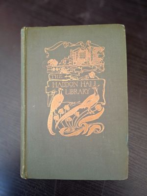 a book on a table that has a picture of a bird on it