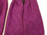 two pieces of purple and black patterned clothing on a hanger