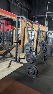 an image of a gym area with a weight machine