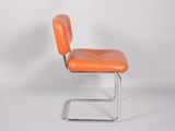 an orange chair with a metal frame on a white background