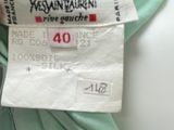 a label on a green shirt that says kessan ' s restaurant