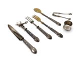 an assortment of silverware including forks, spoons and spoons