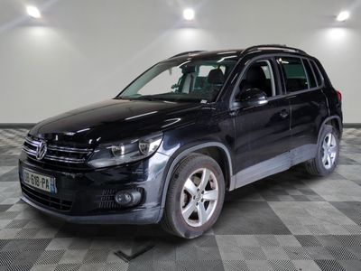 the volkswagen tiguan is parked on a checkered floor in a garage
