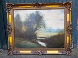 tableau représentant un paysage avec une rivière et des arbres, dans un cadre doré