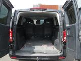 a van that is parked in the parking lot with its doors open