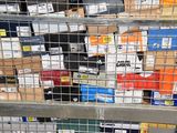 many boxes of electronic devices on the shelves in the store