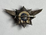 a close up of a badge on a white surface