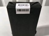 a small black box with a barcode on it