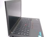 a laptop with a black keyboard sitting on a white surface