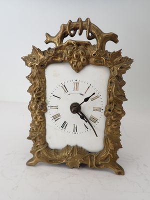 a clock that is sitting on a white table