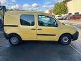the yellow van is parked in the parking lot next to the parking lot