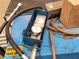 a blue machine with a box on top of it