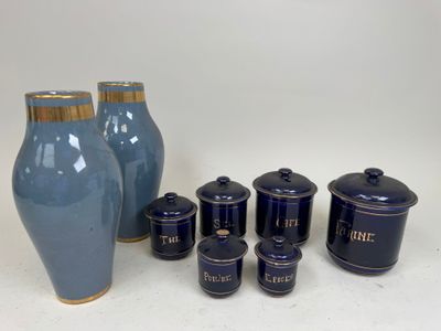 a lot of blue vases that are on the table