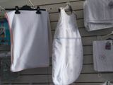 a baby sleeping bag hanging on a clothes rack