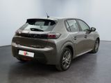 the rear end of a silver car parked in a room
