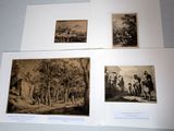 several old black and white photographs of people in a wooded area