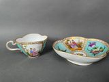 a pair of tea cups and saucers