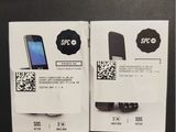 two packages of cell phones are sitting on a table