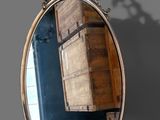 a mirror that is hanging on the wall in the room