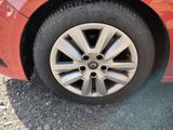 a close up of a tire on a red car