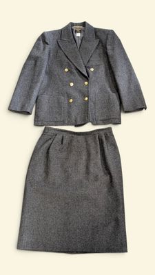 a picture of a woman ' s skirt suit and jacket