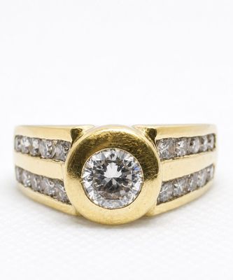 an image of a gold and diamond ring