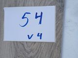 a close up of a sign on the side of a building with a number on it
