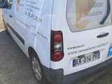 a white van that is parked in a parking lot