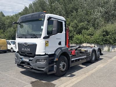 a white truck that is parked on the side of the road
