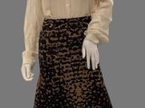 an image of a mannequin dressed in a leopard print skirt and blouse