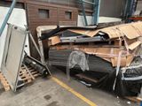 a pile of cardboard sitting on a pallet in a warehouse