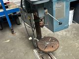 a machine that is sitting on the floor in a garage