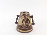 an image of a brown and white vase with a man on it