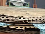 a pile of cardboard sitting on top of a wooden table