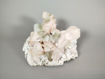a small piece of rock with a lot of crystals on top of it