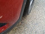 a red car parked on the side of the road