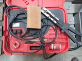 a red tool box with tools in it sitting on a table