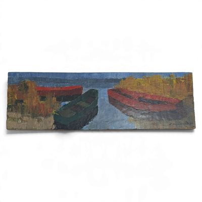 two boats that are sitting on the shore of the water