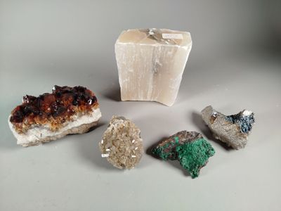 several different types of rocks and stones on a white surface
