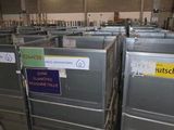 many metal bins in a warehouse with labels on them